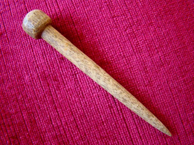 A nice 19th century sailor-carved whalebone bodkin.